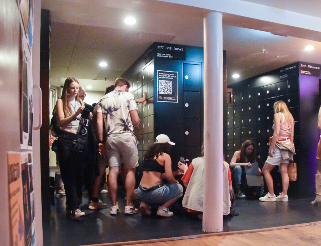 Event guests storing bag in secure locker before event entry