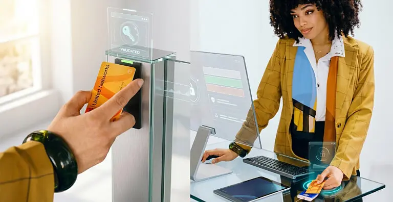 Employee presenting a HID credential as part of a converged physical and digital access journey