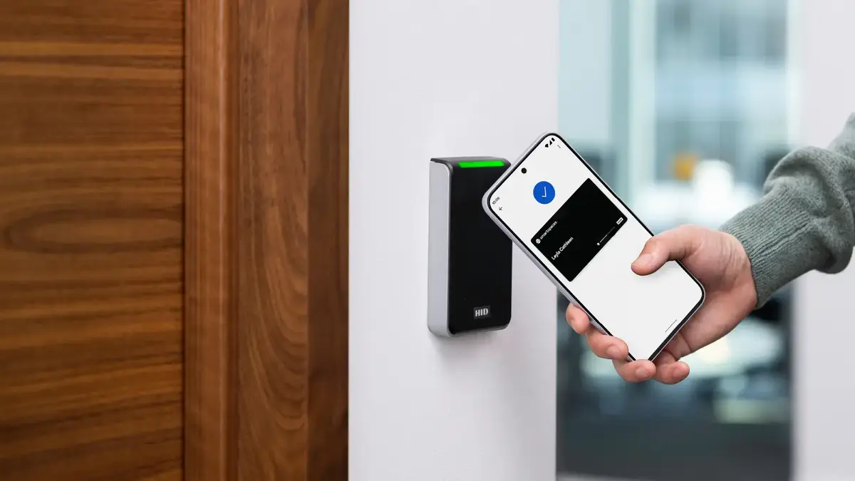 Smart Spaces mobile wallet credential being presented to a workplace access reader